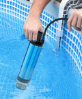 Person using Zero Drama Cordless Submersible Water Pump Heavy Duty Silent Operation Swift Flow Draining in pool water.