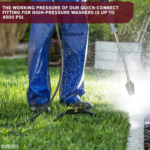 Pressure washer hose connector with brass quick-connect fitting attached to a high-pressure hose on grass