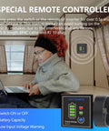 Person using laptop beside 2000W 12V DC To 110V AC Power Inverter With Remote Control And 3 AC Outlets 2.4A USB Port UL Fuses