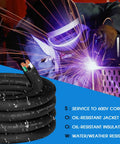 Coiled 15 Foot 10 AWG SOOW Three Conductor Portable Power Cable 30 Amp 600V Extension Cord next to a welder