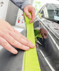 Applying Pro Grade Performance Masking Tape 233 Plus, 24 mm Wide by 55 M Long, on car for precise auto body painting