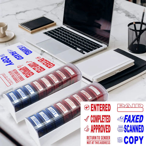 Top Tier Self Inking Office Stamp Set With Eight Gotta Have Rubber Phrases Like Paid And Approved on a desk with laptop.