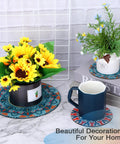 8 Pcs Boho Plant Coaster And Mat Set For Indoor And Outdoor Pots Protect Tables Desks And Floors With Round Flower Saucers In Two Sizes 12 By 12 Cm And 22 By 22 Cm shown with plants and cup
