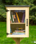Outdoor Library Box For Book Exchange Rustic Wood Cabinet Sized 16x14x22 Inches in park setting with visible books inside