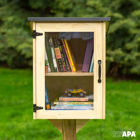 Outdoor Library Box For Book Exchange Rustic Wood Cabinet Sized 16x14x22 Inches in park setting with visible books inside