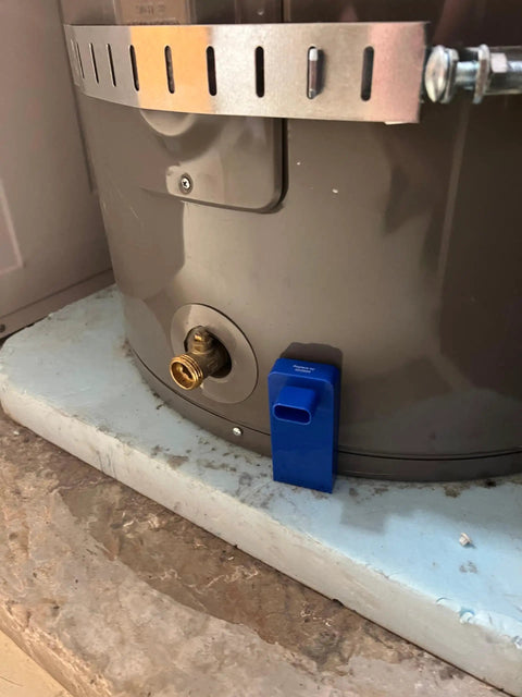 Blue Model Water Leak Alarm For Water Heaters And Pans, Ready To Go With Factory Battery next to a water heater pan