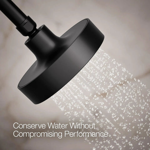 Purist Single Function Showerhead With Matte Black Finish, 2.5 GPM Flow spraying water, close-up angle