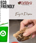 Hand holding used unbleached paper filter for reusable carafe; eco-friendly, compostable, for mess-free coffee or tea brewing.