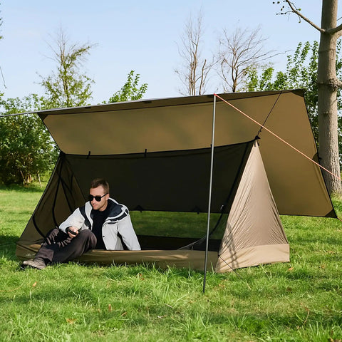 Person under Ultralight 10X10Ft Waterproof Camping Tarp Shelter For Hammock And Tent Campsites Durable Silnylon Rain Gear