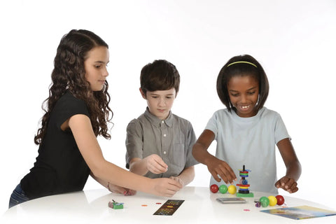 Children performing experiments from Magnetic Science Kit For Kids Ages 8 Plus With 33 STEM Experiments, learning about magnets.