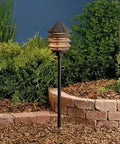 Six Groove Path And Spread 1-Light 12V Landscape Path Light In Textured Architectural Bronze With Clear Polycarbonate Glass Wet Location 9.5 In H By 6 In W Bulb Included standing in garden setting, providing pathway illumination.