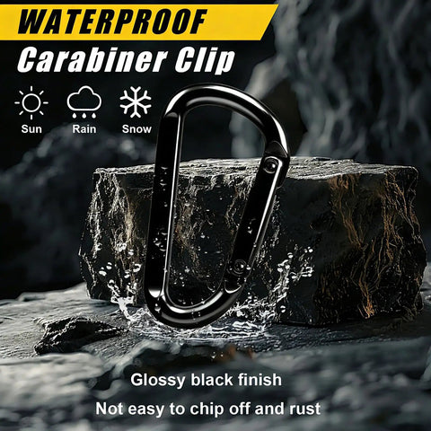 Heavy Duty Black Carabiner Clip Built Tough For 900lbs, 3 Inch Steel D Shaped Snap Hook on rock with water splash