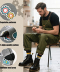 Man in overalls wearing Three Pack Mechanical Engineering Socks Gift Set For Gearhead Men And Techy Dads with gear prints