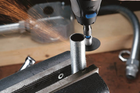 Cutting metal pipe using 70-Piece Do-It-All Rotary Tool Accessory Set With Storage Kit Featuring EZ Lock And EZ Drum For Faster Accessory Changes