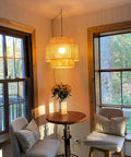 Plug In Pendant Light With Smooth Dimmable Switch And Handwoven Boho Rattan Shade, illuminating a cozy seating area.