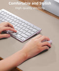 Hands using keyboard and mouse on Beige PU Leather Desk Pad Protector And Mouse Pad Large 31.5 By 15.7 Inch Non Slip Waterproof Desk Mat