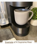 Drip Tray Mug Riser Designed For Coffee Makers To Cut Splashes Cup Stand For Mugs Up To 4.5 Inches Tall Gray 1.25 Inch Tall Riser Only Keeps Brews Steady And Spill Proof shown with a gray mug on a coffee maker