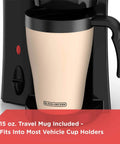 Close-up of Compact Brew And Go Personal Coffee Maker With Travel Mug, showing 15-oz mug fitting into black machine.