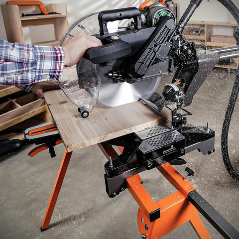 Rock Solid Folding Miter Saw Stand With Quick Three Step Setup And No Sweat Portable Design For Weekend Warrior Woodworking Projects And Ultra Compact Jobsite Storage in use with wood being cut.