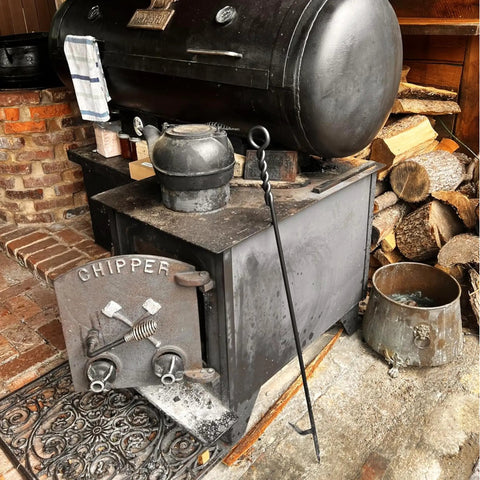 Beefy 40 Inch Heavy Duty Fire Poker With Twisted Rope Grip Solid 12mm Steel by a vintage wood stove and logs