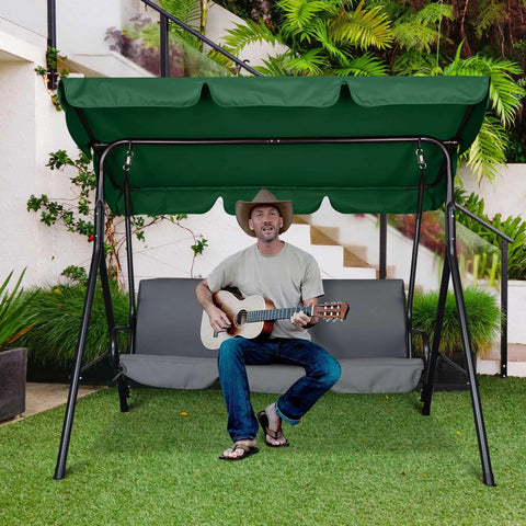 Man sitting on a swing under Outdoor Swing Canopy Replacement UV30 Plus 180Gsm Green Canopy Top 76x44 Inches with guitar.
