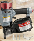 CN55 15 Degree Siding Nailer Coil Type with tools on wooden surface ideal for wooden pallets and fencing projects