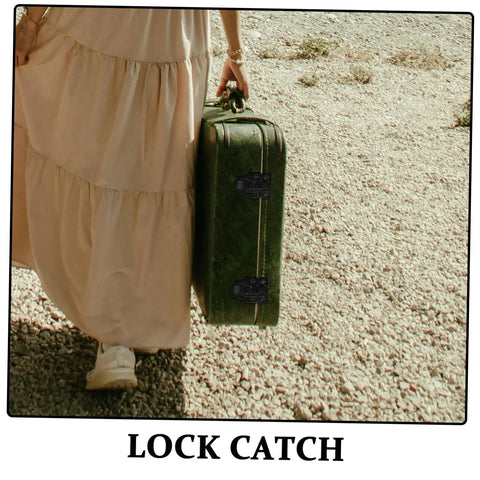Person holding vintage suitcase with retro style duckbilled toggle hasp lock for secure closure, outdoor setting