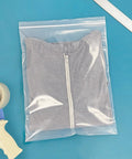 12 By 15 Inch 4 Mil Zipper Reclosable Bags Heavy Duty Poly For Food Storage And Organization, FDA Compliant, durable clear bag with folded shirt