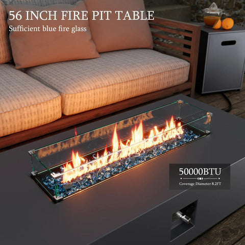 56 Inch Outdoor Propane Fire Pit Table With 50000 BTU Power, blue glass rocks, patio setup with sofa and side table.