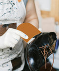 No Slip Rubber Shoe Heel Pads Self Adhesive Heel Protectors being applied to a black shoe for Anti Slip Traction Patches Sole Cushion Replacement