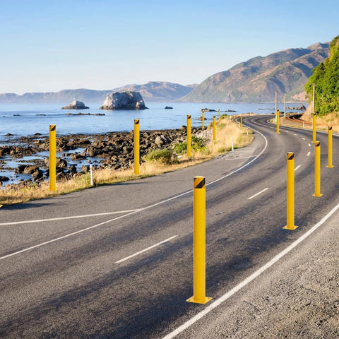 Beat Down Ready 4 Pack 42 Inch Steel Safety Bollards With 16 Anchor Bolts For Driveways And Commercial Parking Lots along coastal road.