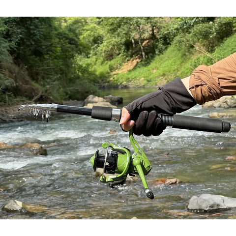 Person holding Go To Telescopic Fishing Pole Combo With Spinning Reels by a river, showcasing fiberglass rod's lightweight design.