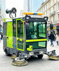 Heavy Duty Commercial Ride On Industrial Sweeper For Warehouses And Factories, bright green model with dual front brushes.