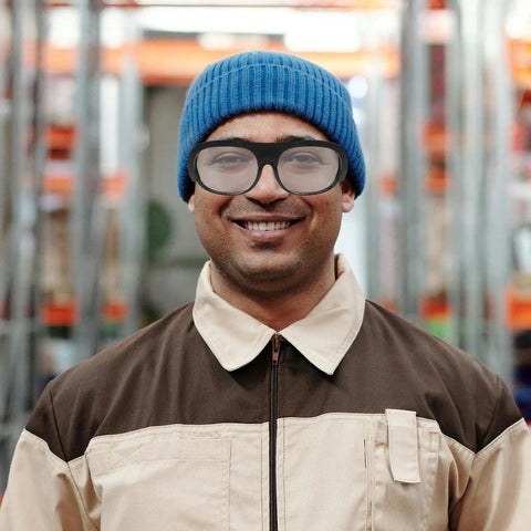 Professional Grade Welding Safety Glasses With Flip Up Lens For Argon Arc And Metalworking 6 Pack Tough As Nails Eye Protection worn by smiling worker