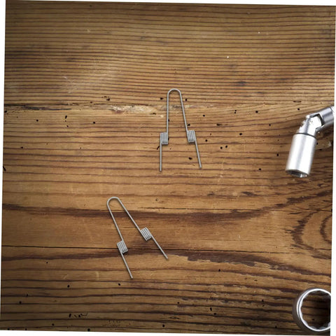 Upgrade Your Kitchen Trash Can With This 4 Piece Stainless Steel Torsion Spring Kit Featuring Dual Coil Design For Easy DIY Installation And Stable Lid Operation On Various Household Garbage Bins You Will Love This Quick Fix Solution. 4 stainless steel torsion springs on wood