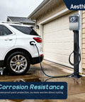 Badass Outdoor EV Charger Pedestal Rock Bottom Anti Wobble Base locks down your ride, shown with a car charging in rain.