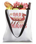 Awesome Father Dragon Boat Dad Tote Bag For Dragon Boating Paddlers Coaches And Enthusiasts Great Gift For Dragonboat Crew Members Who Love Chinese Boat Racing Festivals And Want To Stand Out, white tote with food and flowers inside