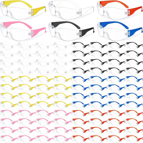Bulk Pack Of 96 Pairs Clear Safety Glasses With Six Color Frames For Adults Unisex Eye Protection Goggles Durable Impact Resistant Protective Eyewear For Work Home DIY Or School Use arranged on display