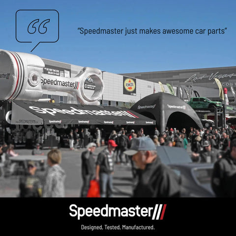 Speedmaster trade show booth with large piston display and attendees, showcasing Heavy Duty Timing Gear Drive Set For Big Block Chevy 396 402 427 454 496 502 Direct Fit Aluminum Construction Performance Grade Upgrade For High Horsepower Builds OEM Style Timing Alignment products.