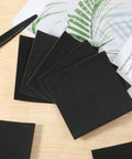 Black adhesive foam squares arranged on a table for soundproofing and vibration dampening, part of Twenty Two Piece Adhesive Foam Squares With Heavy Duty Hold Anti Slip Soundproof Cushioning For Rock Solid Vibration Dampening Furniture Sliders No Fuss Black Backing Big Time Noise Reduction For Diy Projects And Home Office Use.