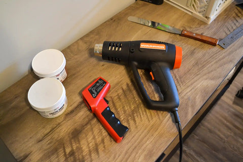 Beast Mode Heavy Duty Dual Temperature Heat Gun For Screen Printing Vinyl Shrink Wrap And Epoxy Resin Drying on a wooden table.
