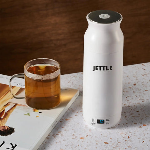 Travel Stainless Steel Electric Kettle 450ml With Temperature Control LED Auto Shutoff next to glass mug on countertop