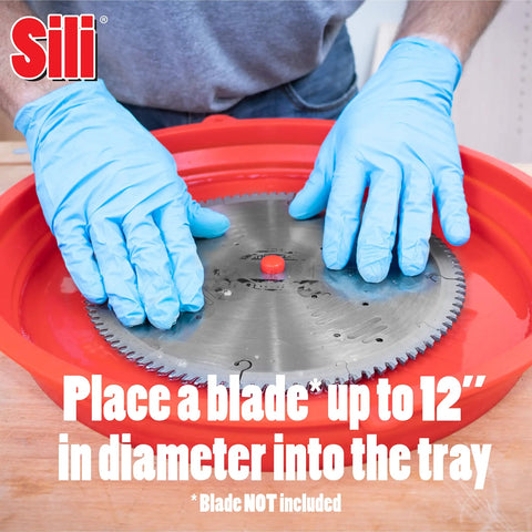 Person with gloves placing a saw blade into Collapsible Silicone Saw Blade Cleaning Tray For Holding Cleaning Solution Ideal For Table Saw Circular Saw Miter Saw And Contractor Blades Up To 12 Inches In Diameter Great For Woodworking Maintenance And Quick Cleanup.