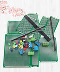 82 Piece Double Sided PCB Board Kit With Five Sizes And 40 Pin 2.54mm Male And Female Header Connectors displayed on surface