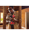 Man using 20V Max Cordless Drill Driver With 1/2 Inch Keyless Chuck and two-speed gearbox in construction scene