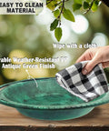 Hanging Bird Bath And Feeder Bowl For Outdoors 12 Inch With Chains Durable Weather Resistant PP Antique Green Backyard Garden Decor being wiped clean.