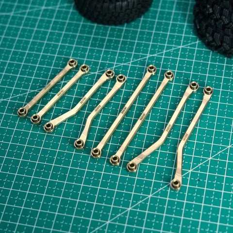 Beefy Brass High Clearance Chassis Links Set For 1/18 TRX4M Defender Bronco RC Crawler Upgrades, 42g Heavy Bent Links on grid mat