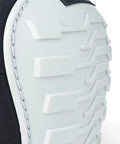 Close-up of Non Marring Knee Pads with heavy duty foam padding, showing white textured cap and black edge detail for stability.