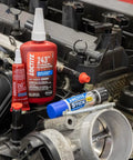 Medium Strength Surface Insensitive Threadlocker For 1/4 To 3/4 Inch Fasteners on an automotive engine with other products