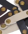 Get These Hella Sturdy Leather Cord Organizers 12 Piece Set With Secure Snap Closures showing durable leather straps with bronze snaps.